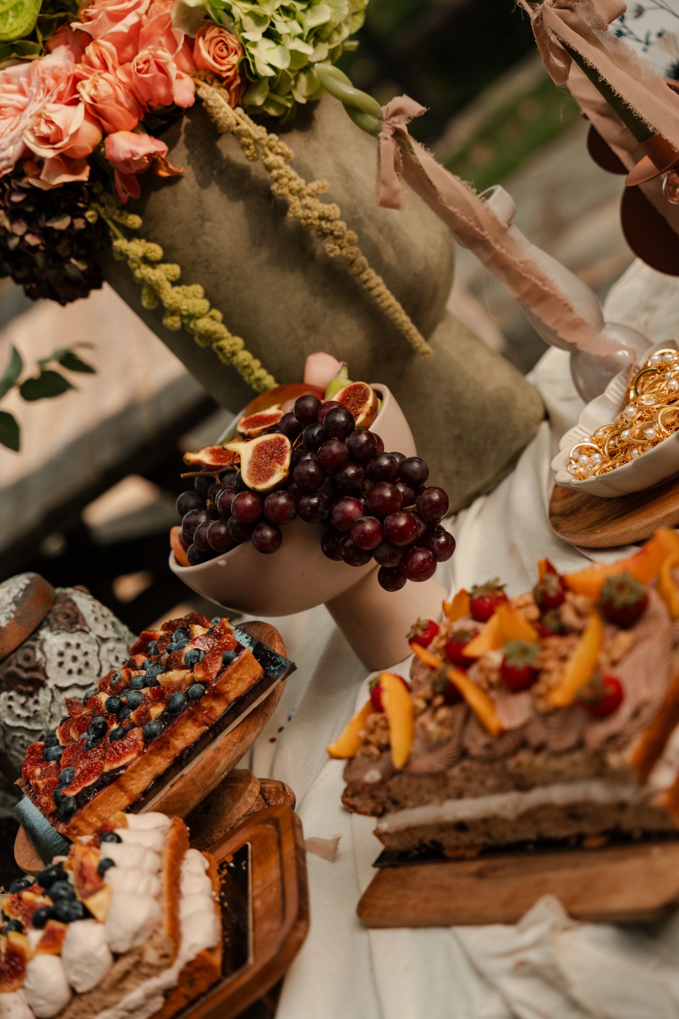 Figs, grapes and pastries arranged on the dessert table