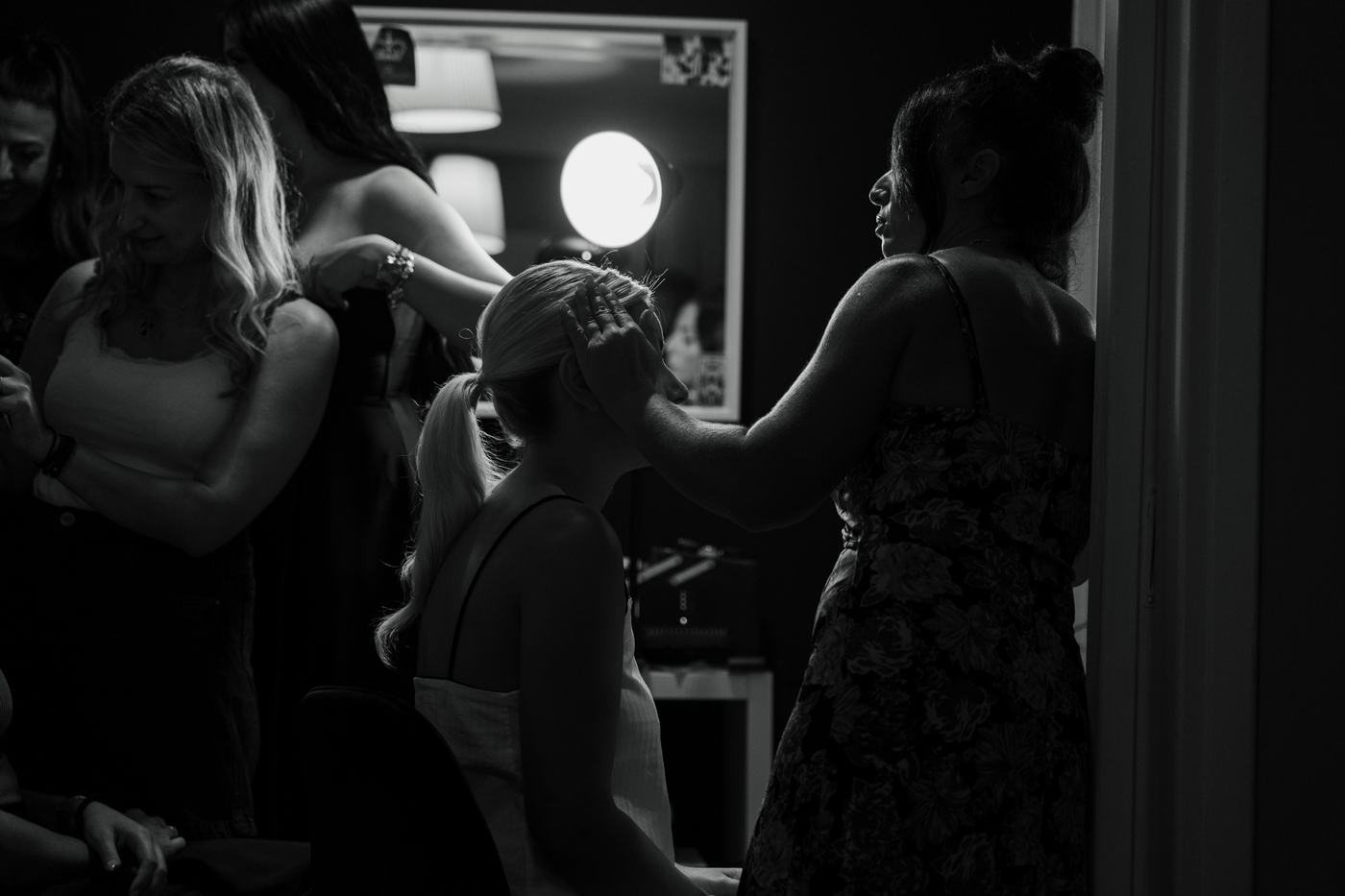 Getting ready before the ceremony in a dim room
